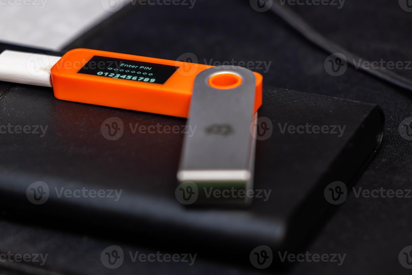Close-up view of Hardware Bitcoin wallet with message Enter PIN 73349817  Stock Photo at Vecteezy