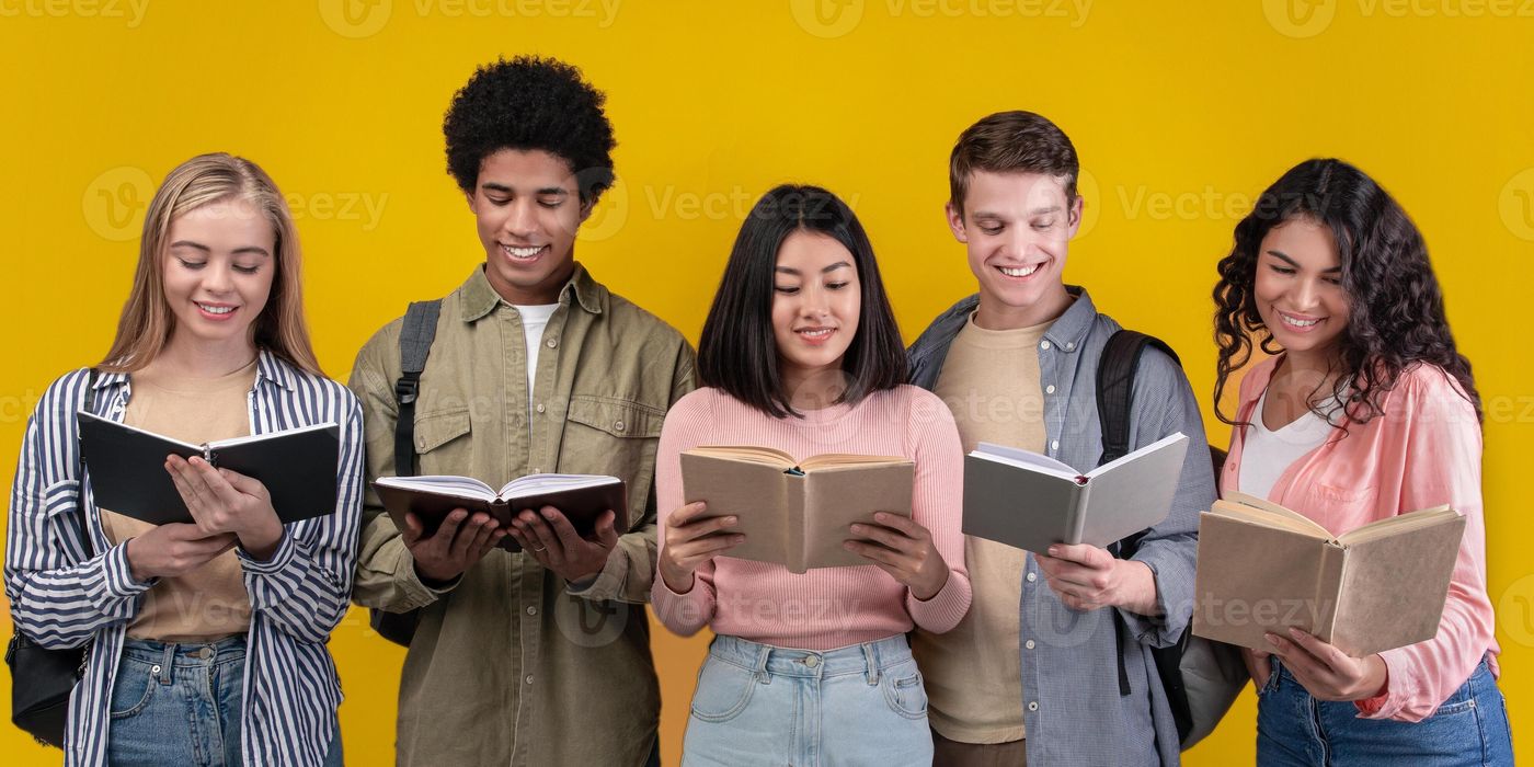 Modern education and teamwork. Happy young university students studying  with books in library, group of multiracial people in college read,