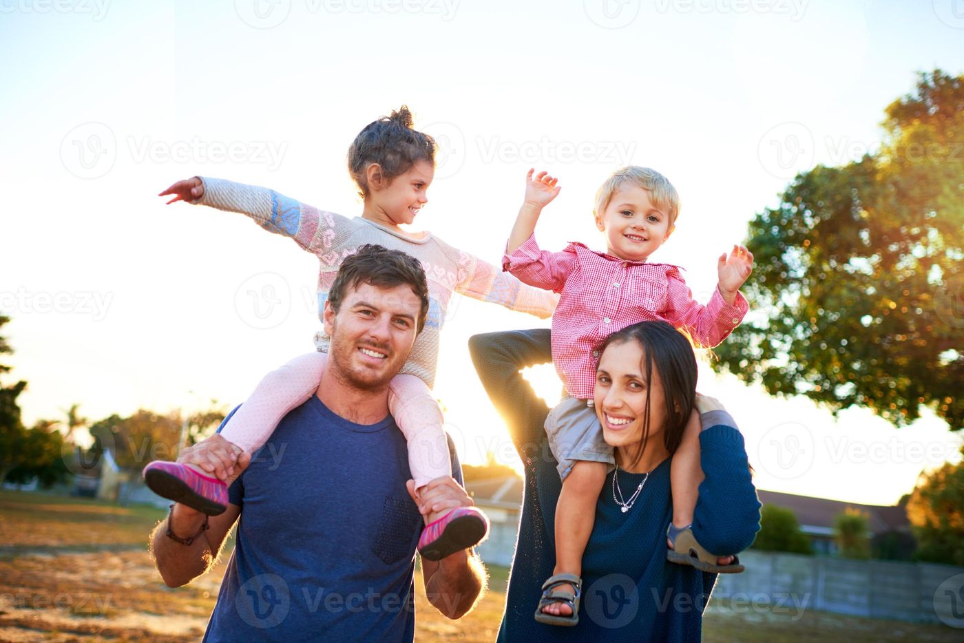 Nature, portrait and parents with children on shoulders for bonding,  playing and having fun together. Happy, family and young mom and dad  