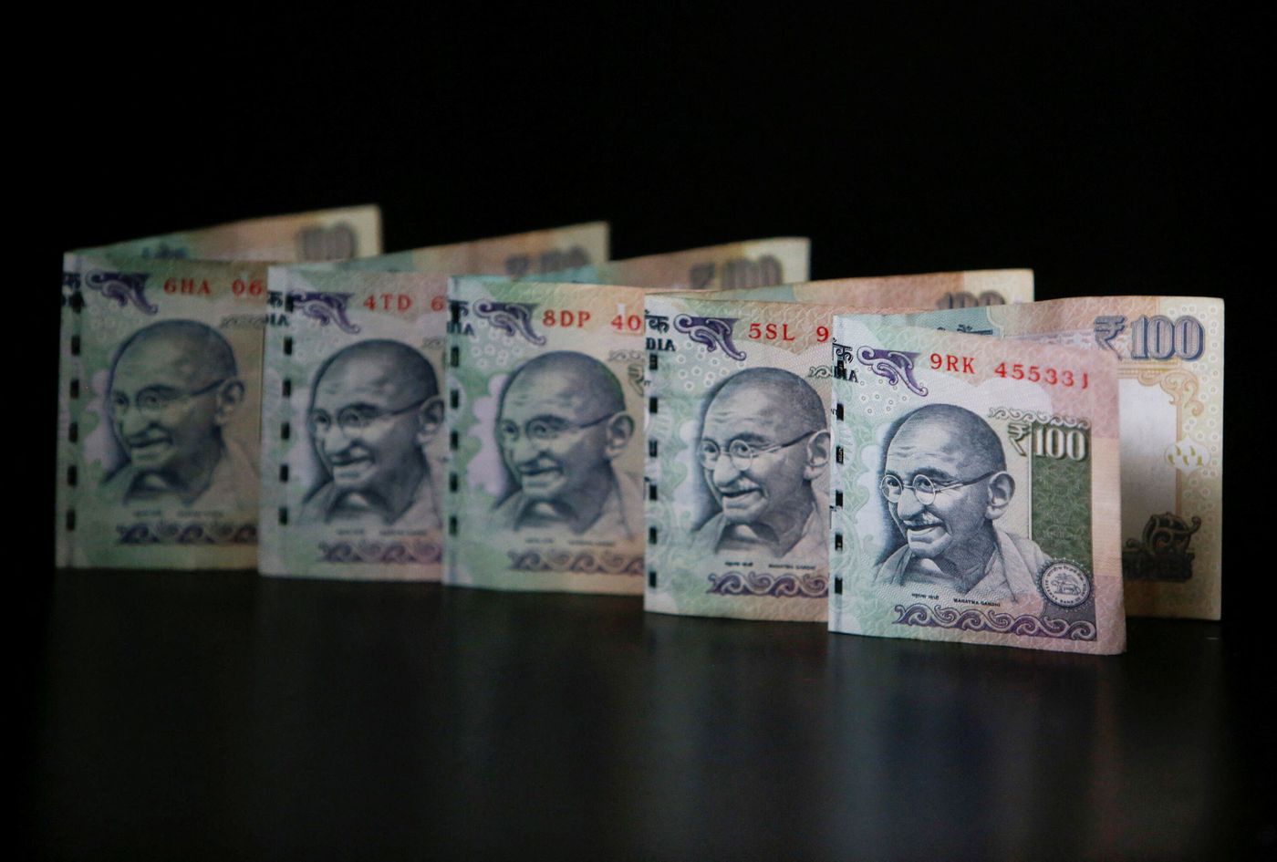 Overvalued Indian rupee slips to record low, tracking Chinese yuan declines  | Reuters