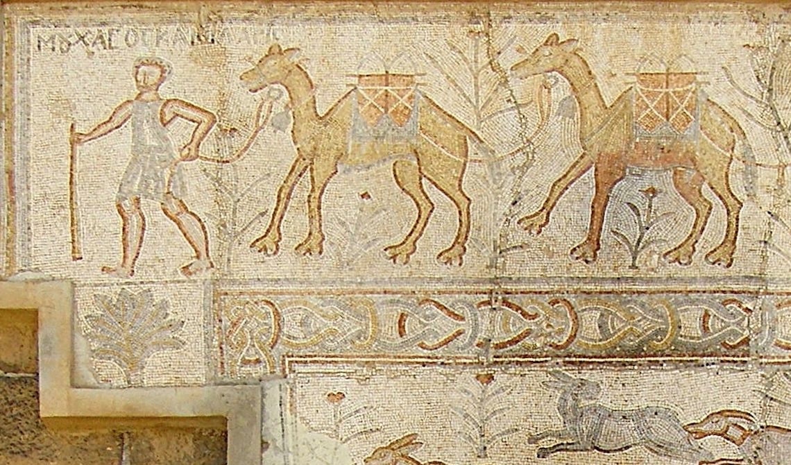 Ancient Roman mosaic from the Syrian city of Bosra depicting a bearded man, likely a caravan merchant leading a camel train through the dese
