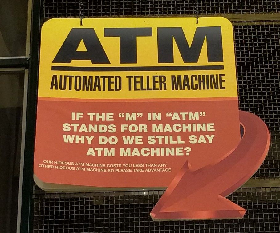 Sign joking about the redundant phrase “ATM Machine”, an instance of RAS Syndrome.