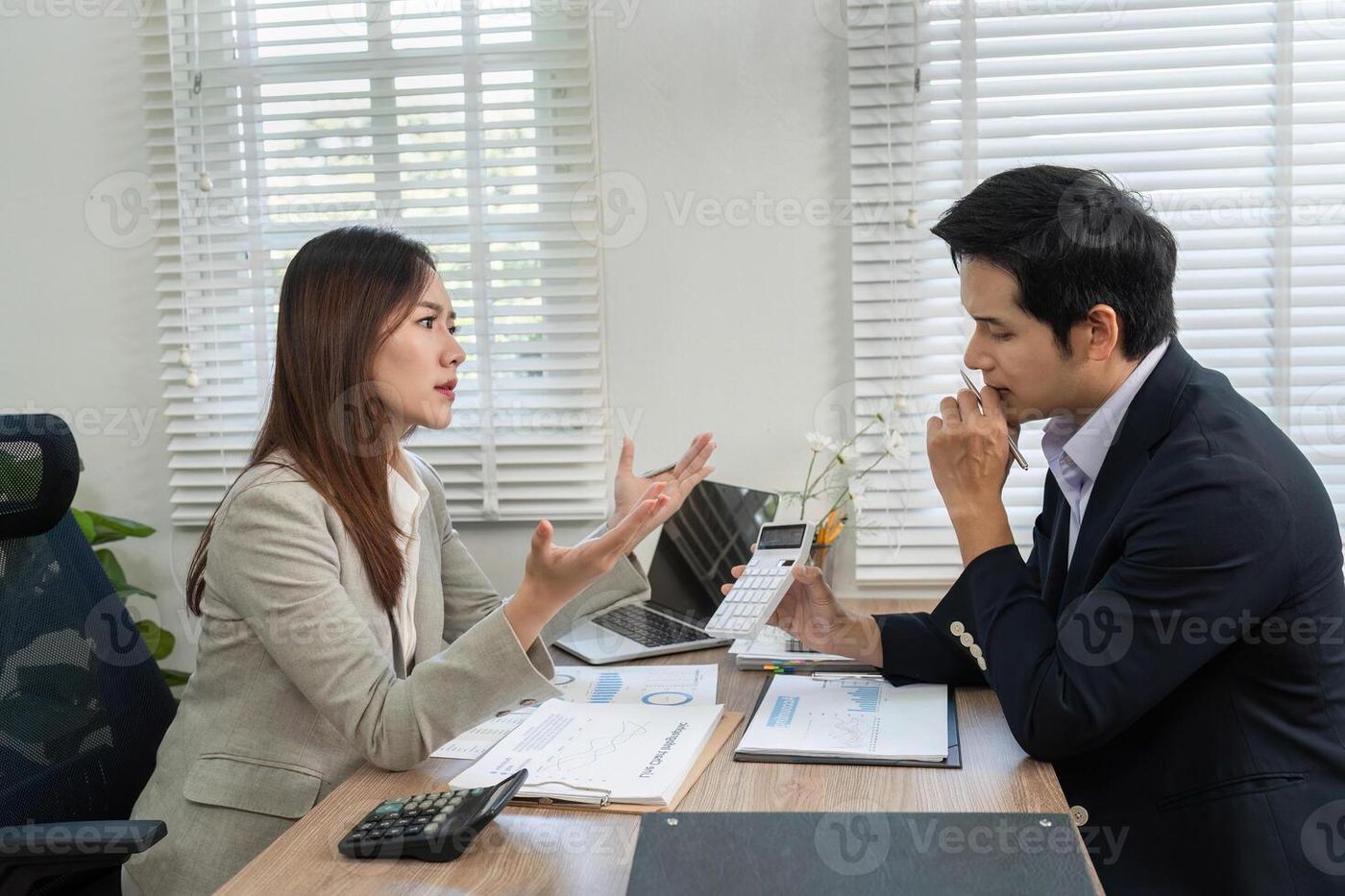 Financial Consultation. Engaging discussion between a financial advisor and  client in a modern office. 66374388 Stock Photo at Vecteezy