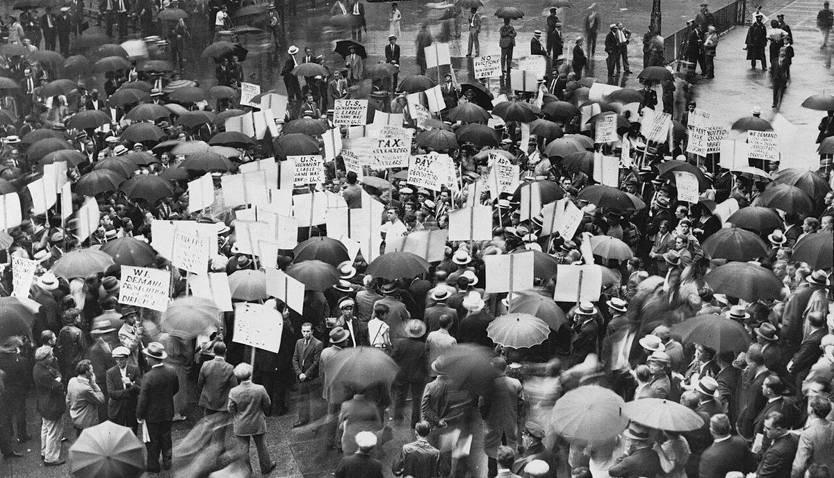 Crowd of depositors gather in the rain outside Bank of United States after its failure.