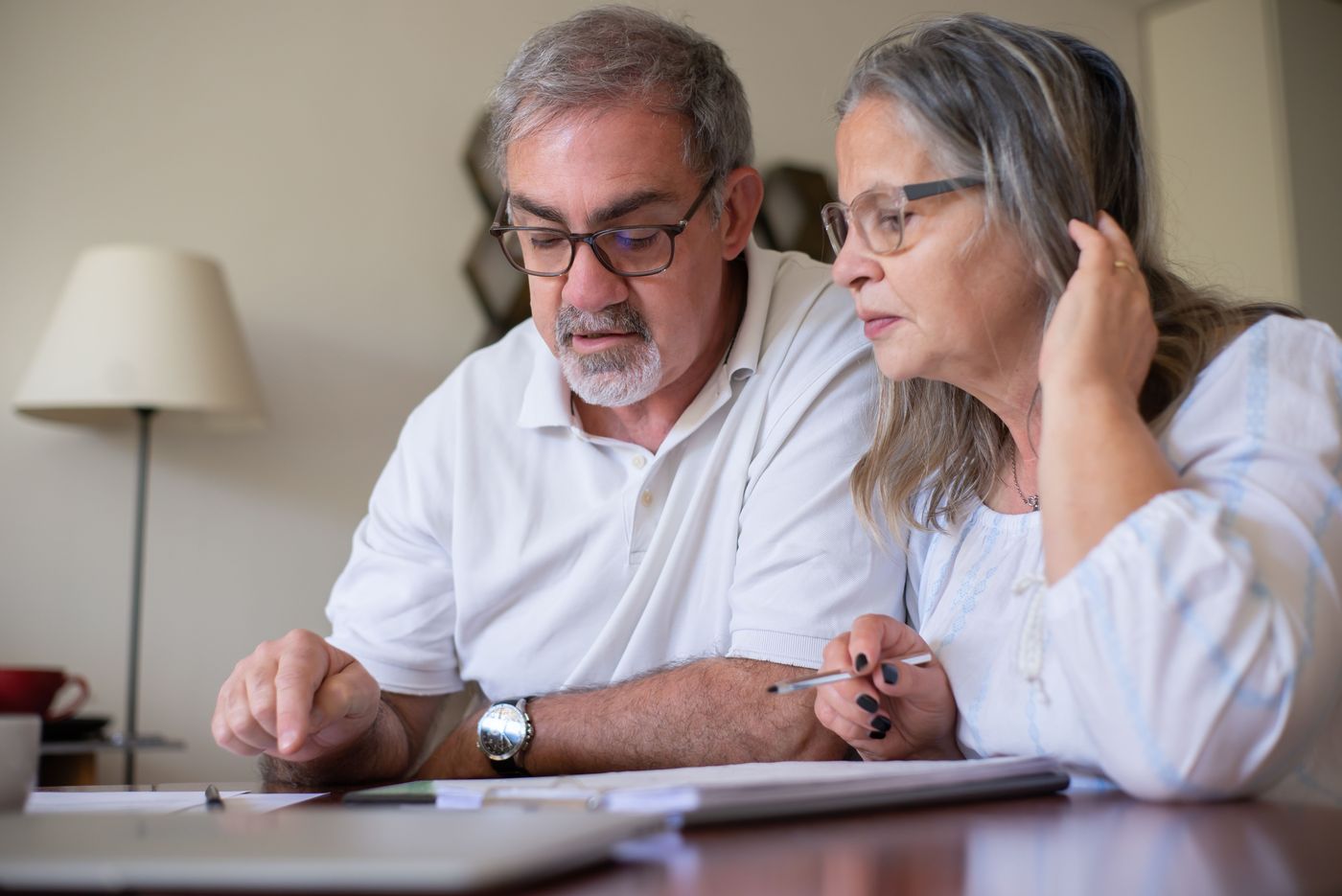 Elderly Couple Completing Documents · Free Stock Photo