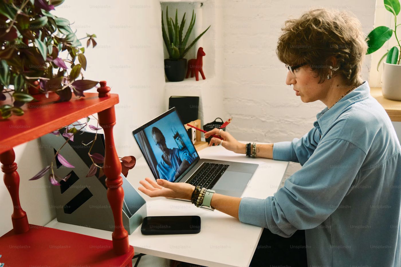 Person working on laptop in a home office, Photo on Unsplash+