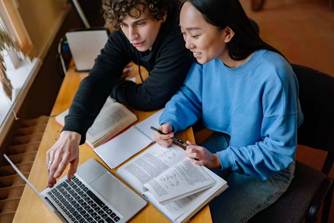 Students Studying Together while Looking at the Screen of a Laptop · Free  Stock Photo