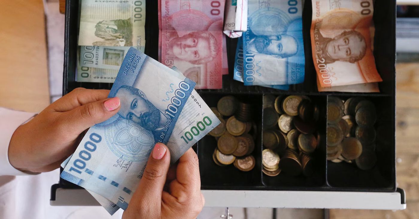 Chile's sliding peso reflects tough battle vs rampaging dollar | Reuters