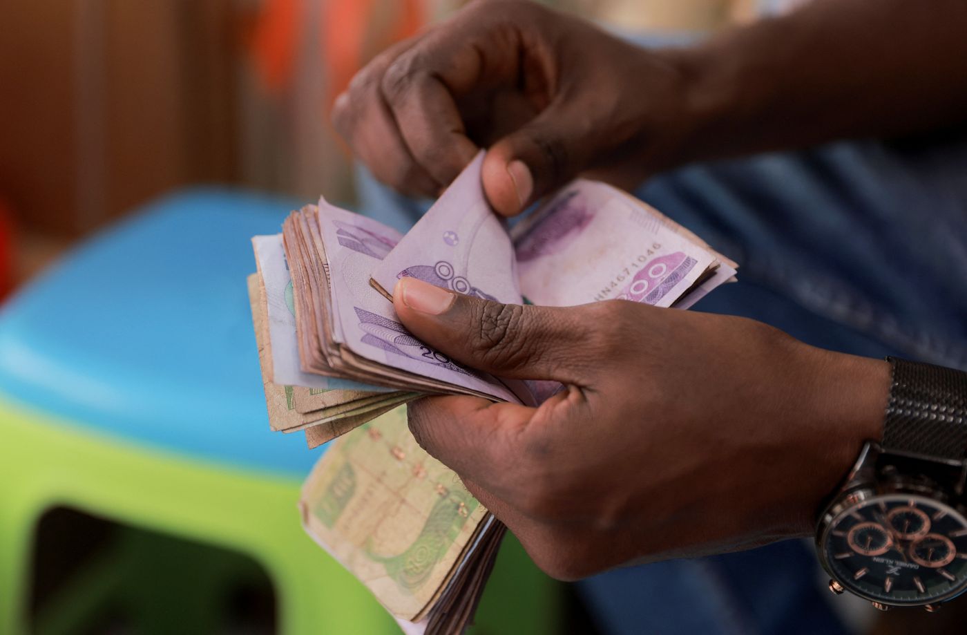 Ethiopia's birr drops 30% as central bank floats currency | Reuters