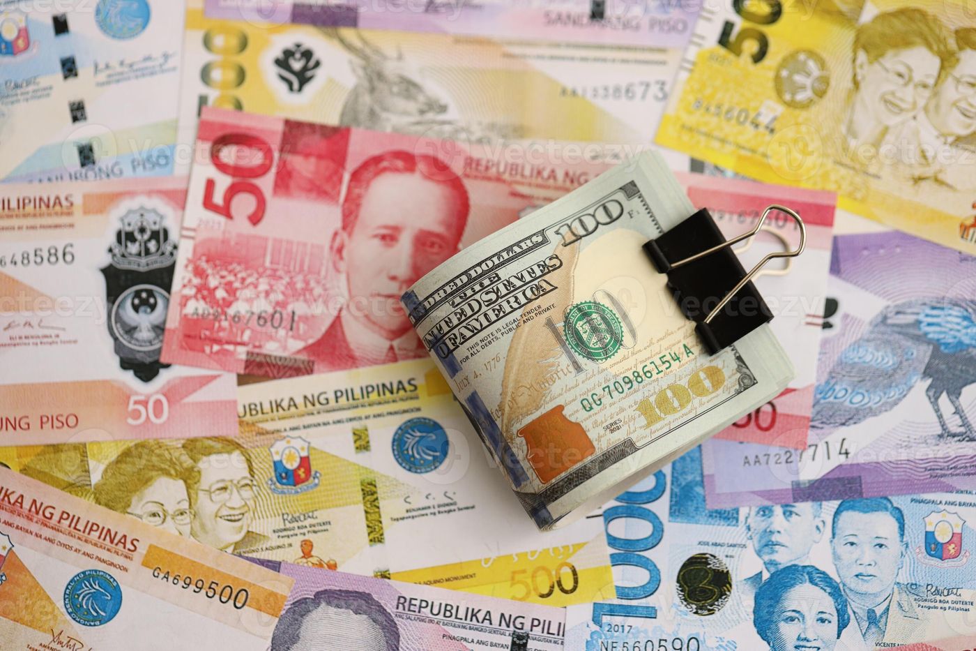 Philippines peso currency bills and bunch of us dollar banknotes. The  concept of economics and currency 69259799 Stock Photo at Vecteezy