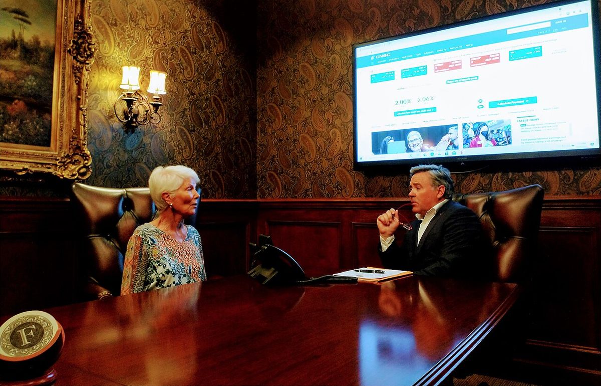 A Wealth Management] meeting with a client to come up with an investment strategy.